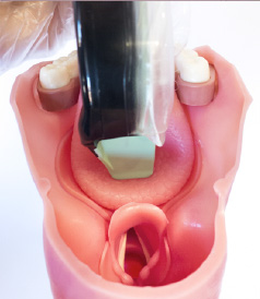 Pushing tongue inwards
